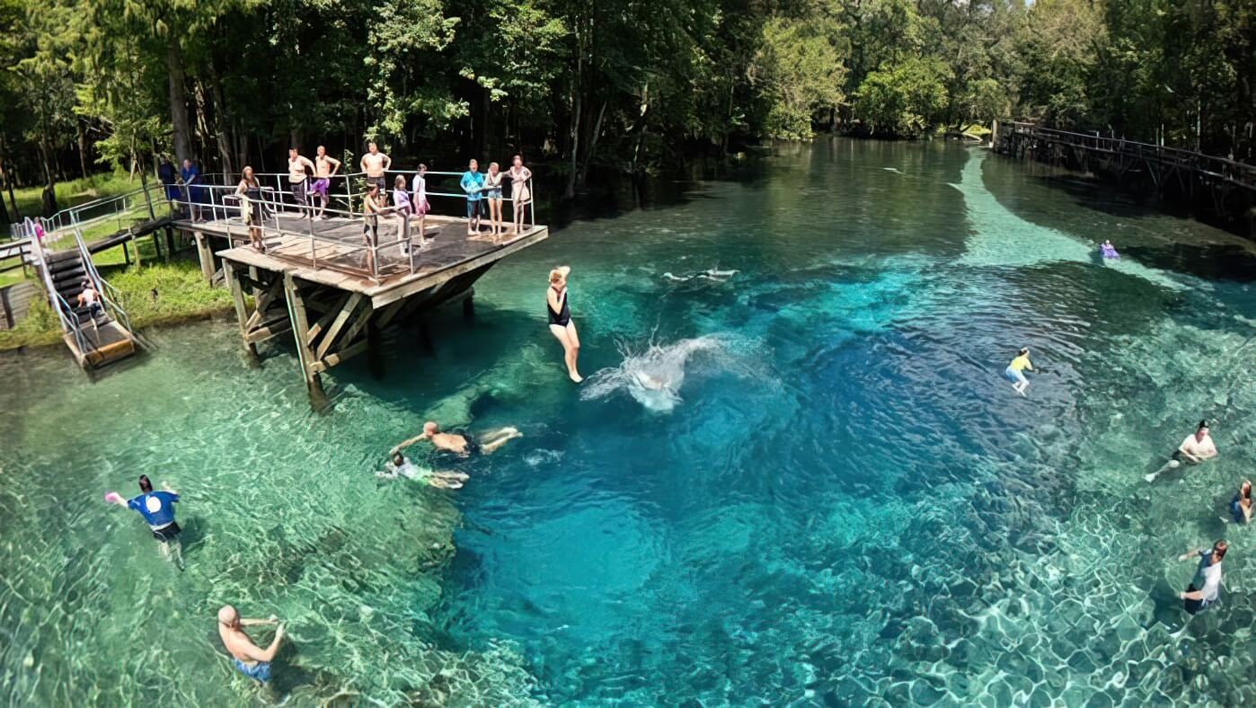 people jumping into the water at Blue Springs