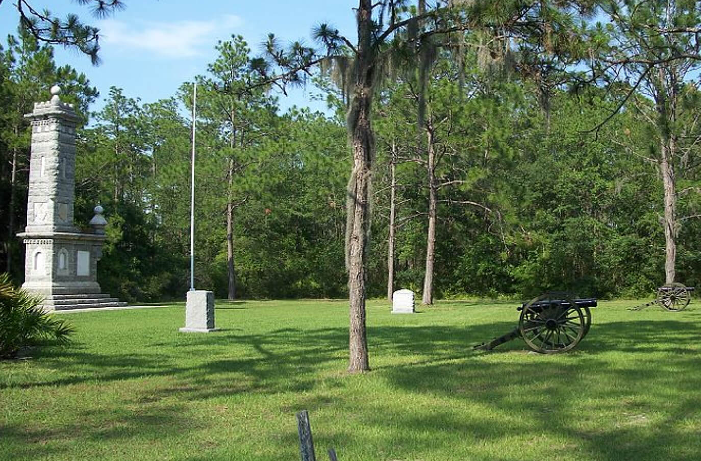 a park with monuments and cannons