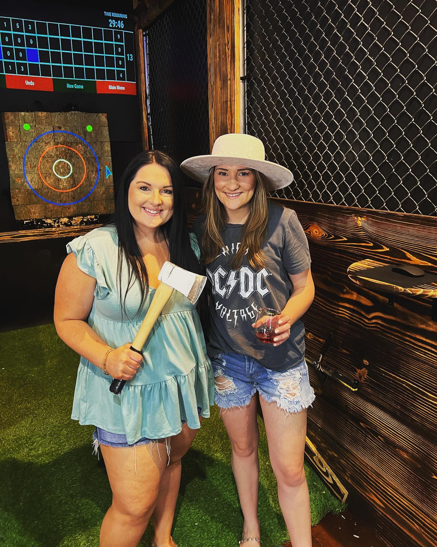 friends pose during axe throwing